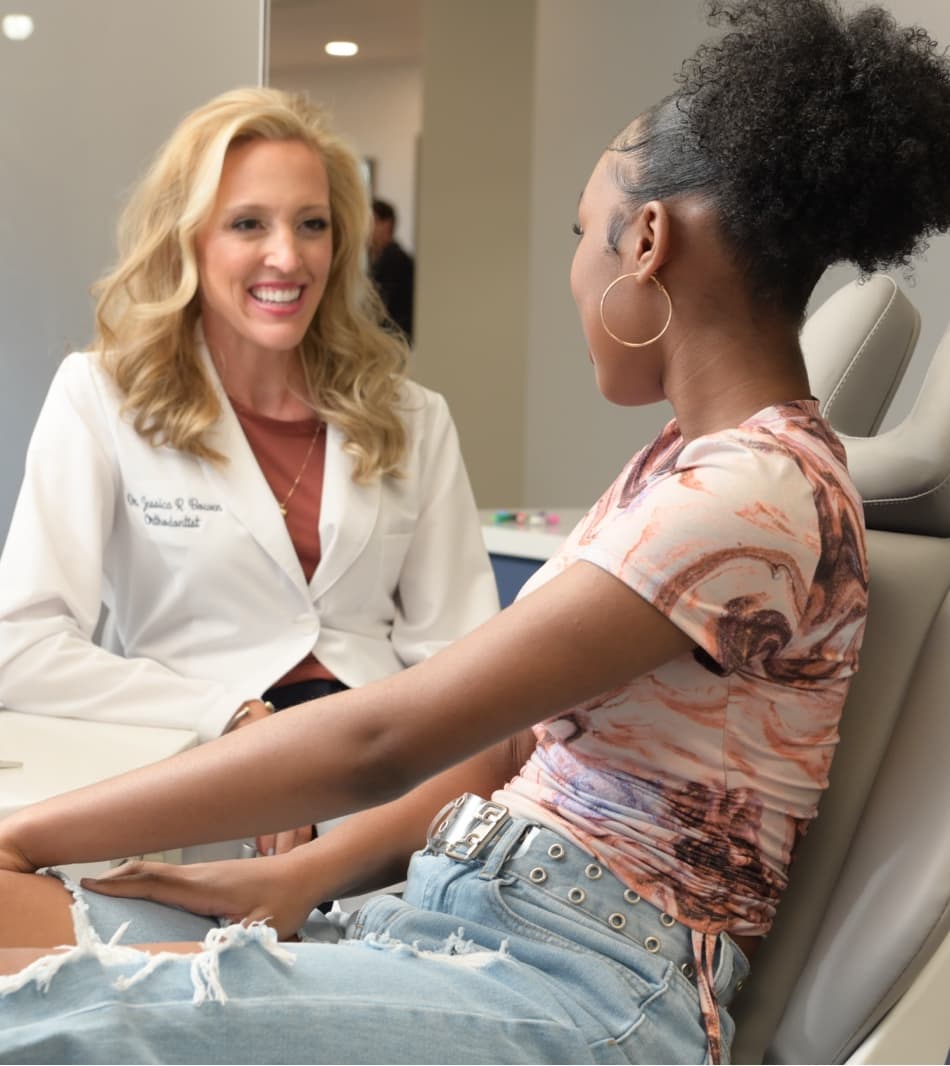 Dr. Bowen smiling with teen patient