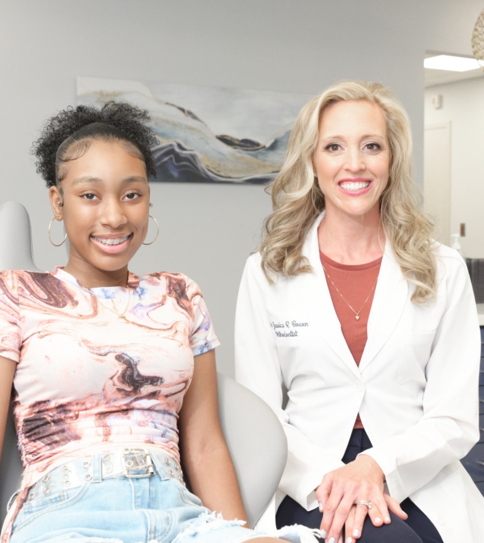 dr. Bowen smiling with teen patient during visit